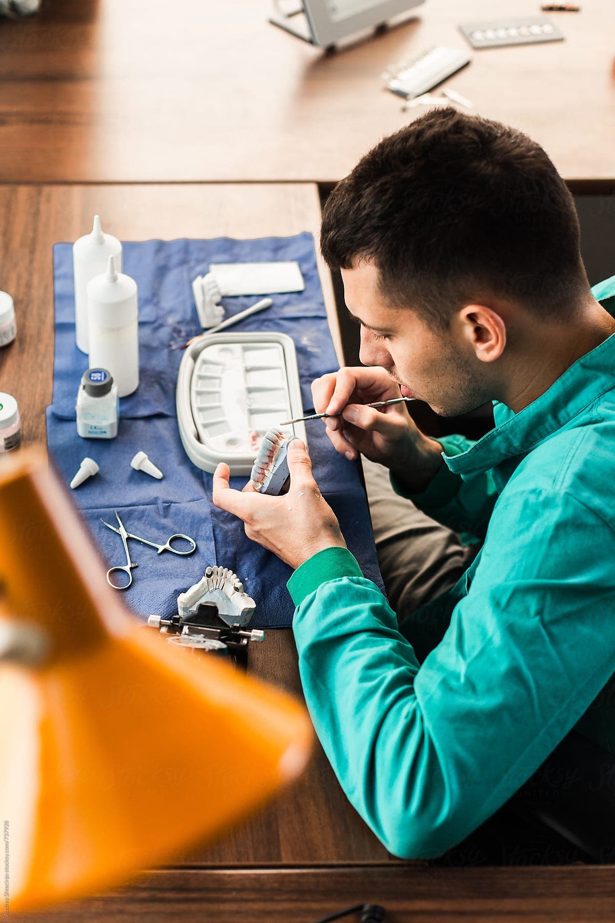 dentist working on dentures