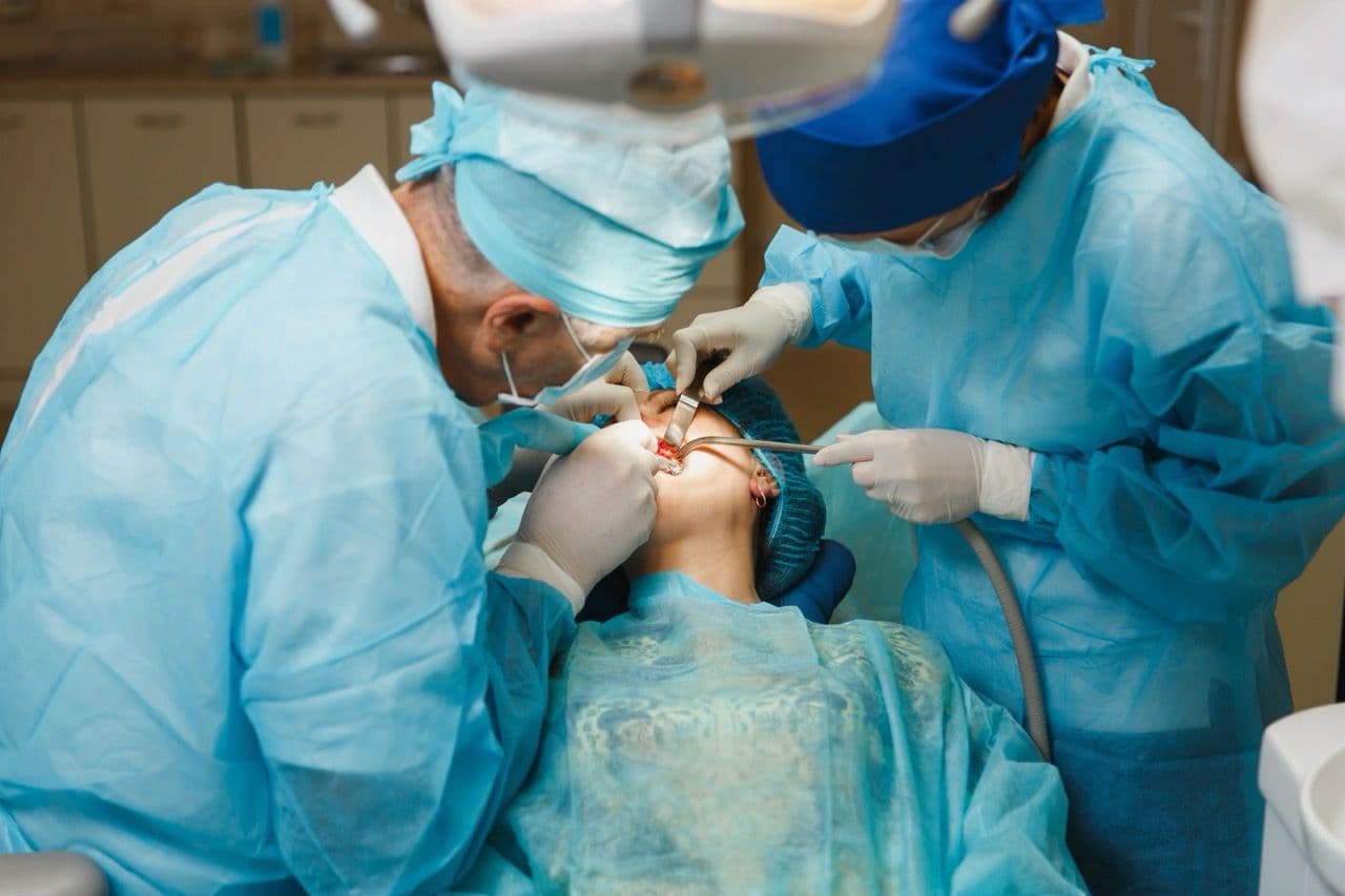 Photo of a dentist team treating a patient