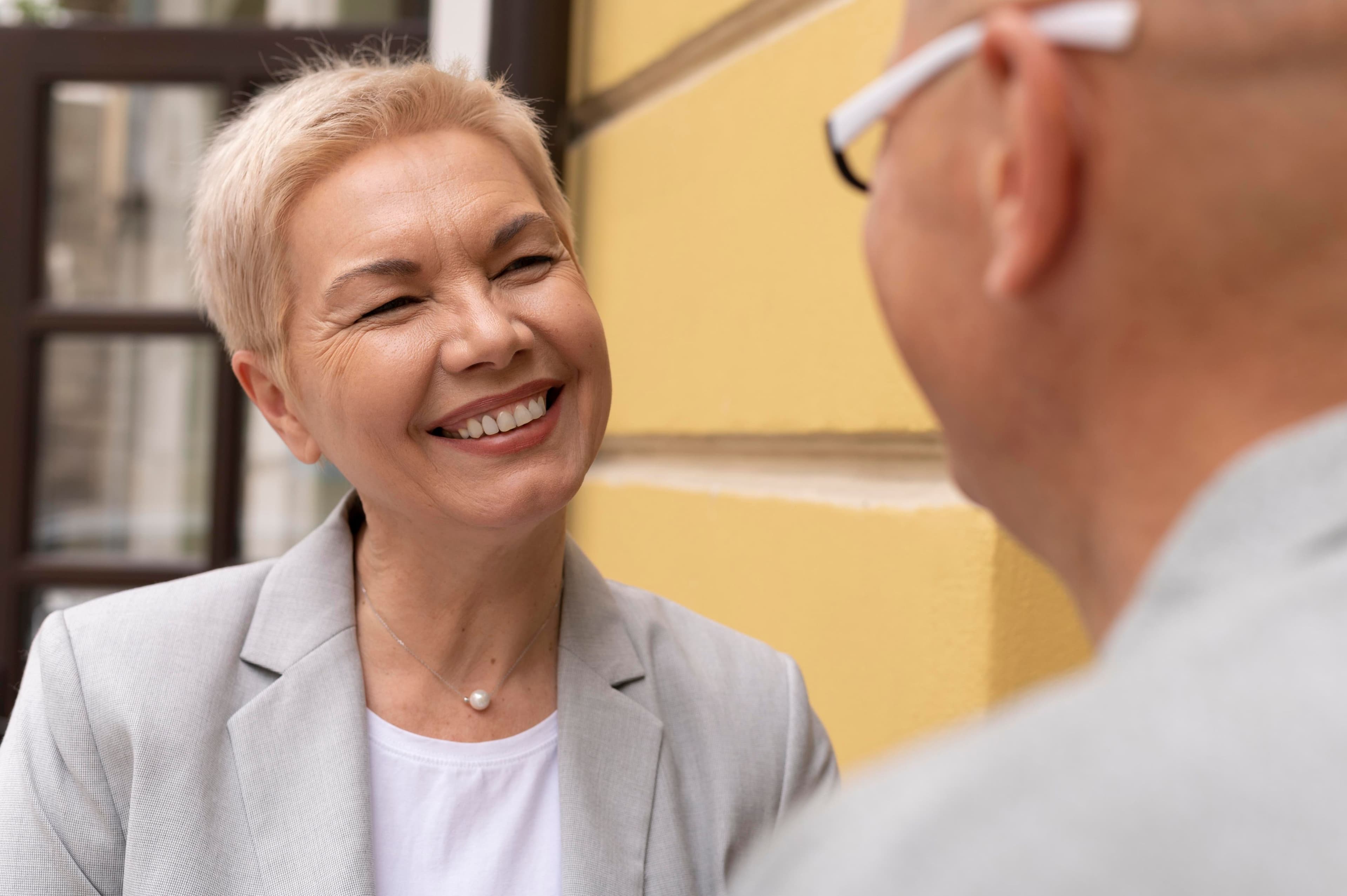 woman talking to male dentist